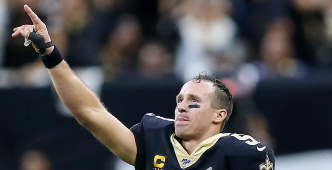 New Orleans Saints quarterback Drew Brees (9) acknowledges the crowd after breaking the career NFL touchdown mark in the third quarter against the Indianapolis Colts at the Mercedes-Benz Superdome.