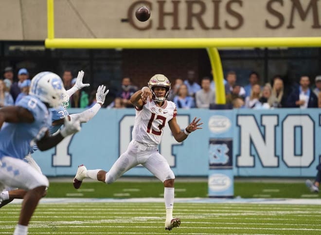 Florida State quarterback Jordan Travis makes a throw on the run Saturday against North Carolina.