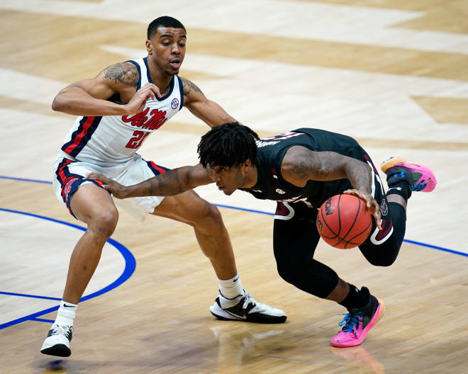 South Carolina guard Trae Hannibal (12) bolts past Ole Miss forward Robert Allen (21) during the first half of the SEC Men's Basketball Tournament game at Bridgestone Arena in Nashville, Tenn., Thursday, March 11, 2021.