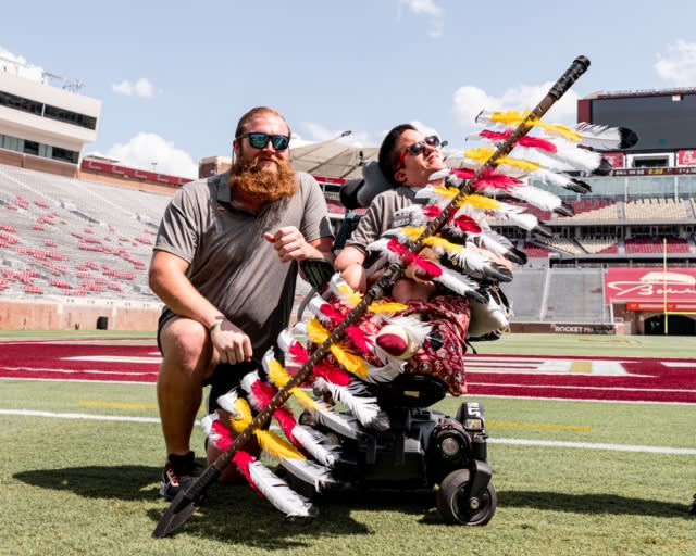 FSU offensive lineman Dillan Gibbons poses with friend Timothy Donovan after raising money to help get him to Tallahassee for the 2021 FSU-Notre Dame game.