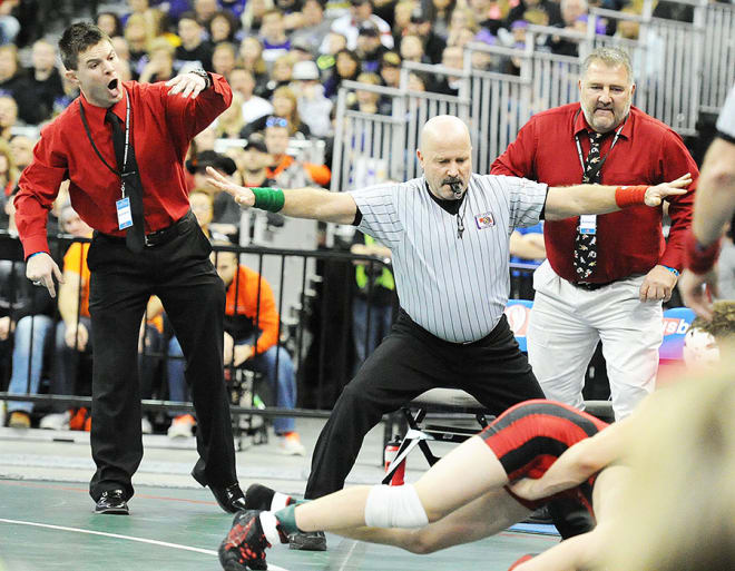 Tyler Herman (left) and assistant Dave Klingelhoefer have helped build Amherst into a wrestling powerhouse. Coach Herman has announced his resignation at the end of this season, as he plans to accept an administration position with Kearney Public Schools.