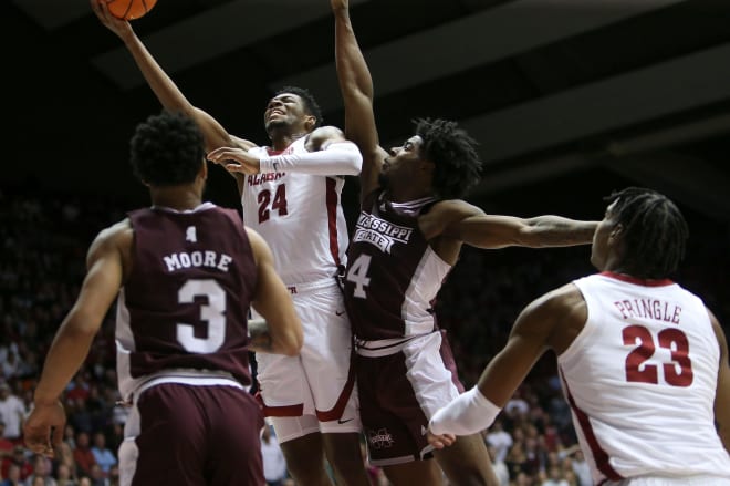 Alabama forward Brandon Miller (24) fights for a shot inside with Mississippi State forward Cameron Matthews (4) defending at Coleman Coliseum. Photo | Gary Cosby Jr.-Tuscaloosa News / USA TODAY NETWORK