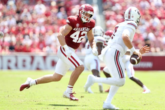 Arkansas Razorbacks linebacker Drew Sanders (42) pursues South Carolina Gamecocks quarterback Spencer Rattler (7) during the second half at Donald W. Reynolds Razorback Stadium. Photo | Nelson Chenault-USA TODAY Sports