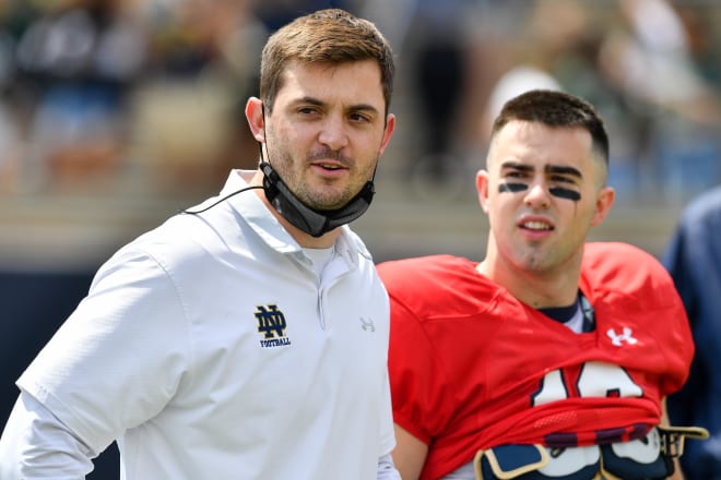 Notre Dame offensive coordinator Tommy Rees (left) with quarterback Drew Pyne. 