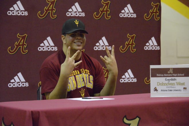 Dohnovan West signs his letter of intent to Arizona State  (Alemany Athletics)