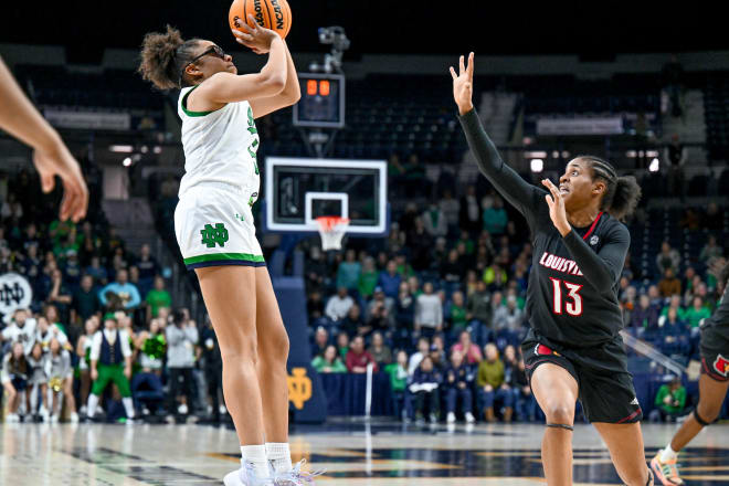 Point guard Olivia Miles (left) launches her game-winning shot at the buzzer in OT as Notre Dame prevails, 78-76.