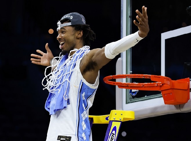 UNC senior Leaky Black celebrates afetr cutting down the nets Sunday night in Philadelphia.