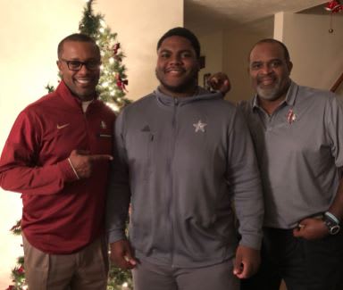 One of Willie Taggart's first objectives as head coach was to solidify the commitment of DT Robert Cooper, and Cooper signed with the Seminoles on Wednesday. Pictured from left are Taggart, Cooper and FSU defensive tackles coach Odell Haggins.