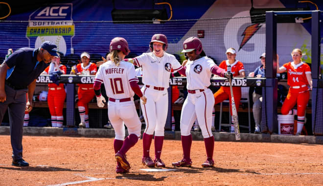 The Seminoles celebrate Josie Muffley's home run, which started the scoring on Thursday.