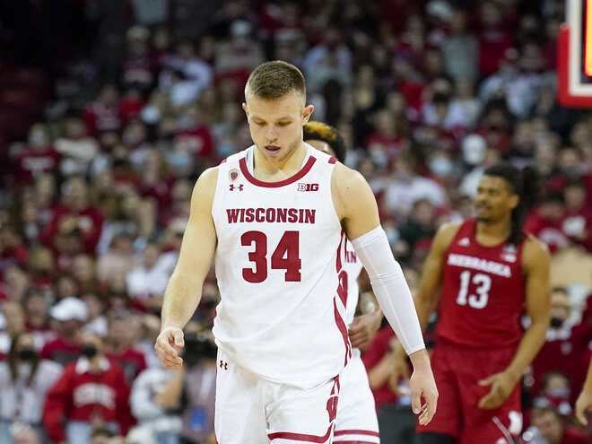 Wisconsin's Brad Davison walks off the court after Wisconsin lost 74-73 to Nebraska.