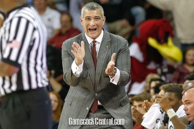 Frank Martin smiles in disbelief after a jump ball was called.