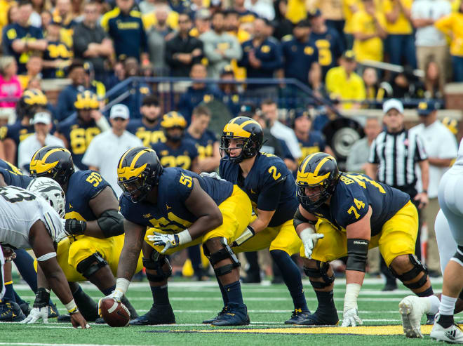 Michigan Wolverines football redshirt senior left guard Ben Bredeson (No. 74 above) is one of just 14 players in U-M history to be named a two-time captain.