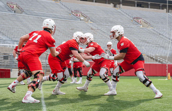 Wisconsin's offensive line works during the first day of 2021 spring practices