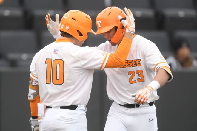 Tennesee s Dean Curley (23) is congratulated by teammate Cal Stark (10) after hitting a home run during a game between Tennessee and Bowling Green at Lindsey Nelson Stadium in Knoxville, Tenn., Friday, March 1, 2024.