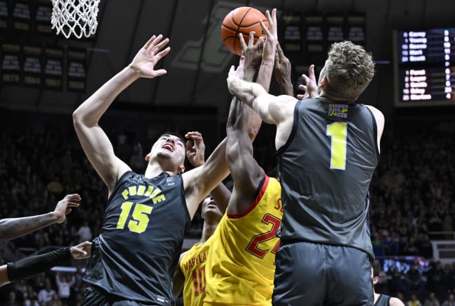 9Jan 22, 2023; West Lafayette, Indiana, USA; Purdue Boilermakers center Zach Edey (15) and forward Caleb Furst (1) fights for a rebound against Maryland Terrapins forward Donta Scott (24) during the second half at Mackey Arena. Mandatory Credit: Marc Lebryk-USA TODAY Sports