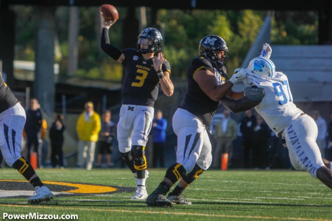Missouri quarterback Drew Lock threw for 350 yards and four touchdowns and also ran for 36 yards against Memphis.