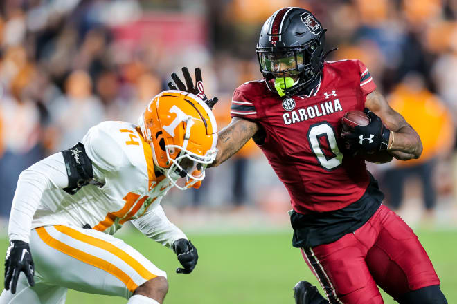 Tennessee defensive back Christian Charles tries to tackle South Carolina tight end Jaheim Bell. 