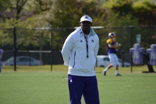 Second year East Carolina head football coach Scottie Montgomery taking in practice on Monday.