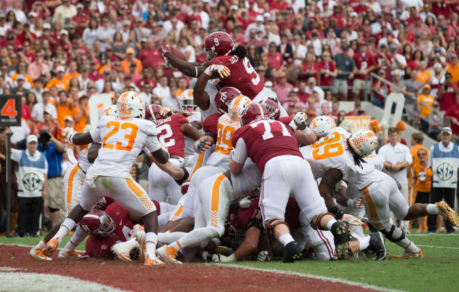 Alabama Crimson Tide running back Bo Scarbrough (9) goes up and over for a touchdown against Tennessee Volunteers in the second quarter at Bryant-Denny Stadium. Photo | USA Today