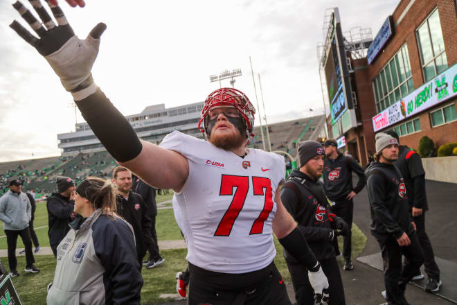 Former Western Kentucky Hilltoppers offensive lineman Mason Brooks (77) during warmups prior to their game against the Marshall Thundering Herd last November at Joan C. Edwards Stadium. Brooks announced his decision to transfer to Ole Miss Monday. Mandatory Credit: Ben Queen-USA TODAY Sports