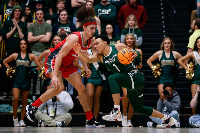 Colorado State Rams guard John Tonje (1) controls the ball as New Mexico Lobos forward Josiah Allick (53) guards in the first half at Moby Arena.