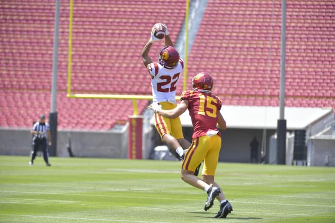 Junior cornerback Dorian Hewett makes an interception on Slovis.