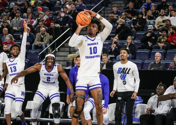 Junior wing Elias King spots up as his sharp shooting takes the Blue Raider offense to the next level at the Northern Classic. (Photo credit: MT Athletics). 