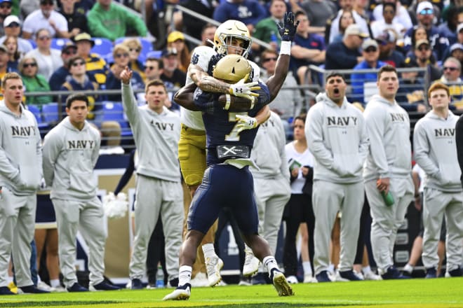 ND senior receiver Braden Lenzy takes the ball off the back of Navy cornerback Mbiti Williams Jr. for a 38-yard TD reception.