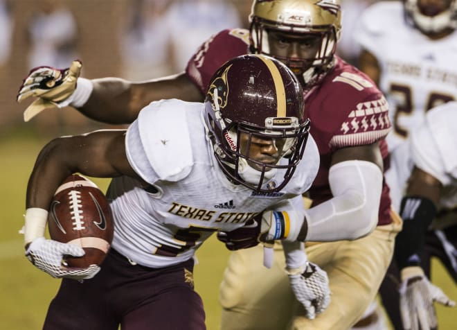 Ro'Derrick Hoskins wraps up a Texas State ballcarrier early in the 2015 season.