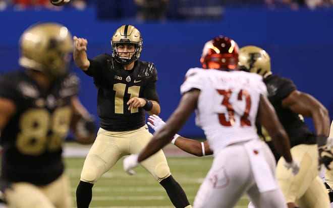 David Blough throws his first pick vs. Louisville Saturday. Monday, he lamented his bad footwork on the toss. 