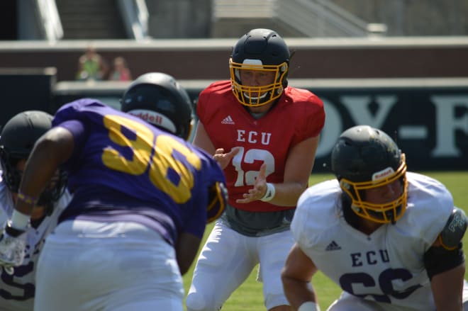 Holton Ahlers takes a snap in Saturday's first stadium scrimmage of this year's ECU fall football camp.