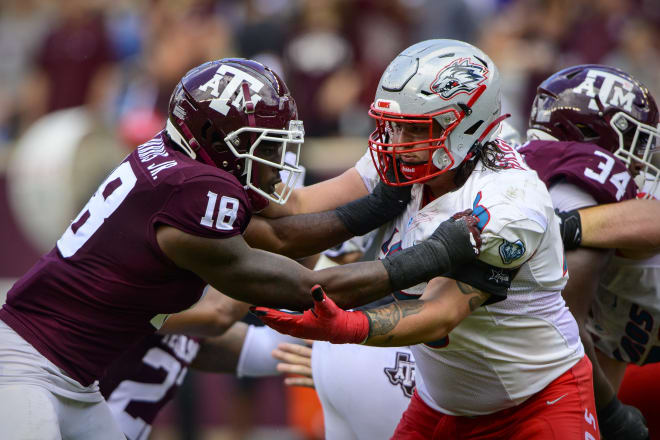 Sep 18, 2021; College Station, Texas; Texas A&M Aggies defensive lineman Donell Harris Jr. (18) works against a block by New Mexico Lobos offensive lineman Cade Briggs (73) during the second half at Kyle Field.