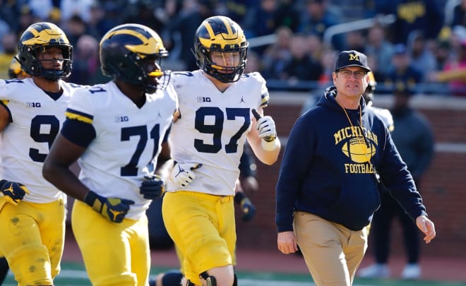 Michigan Wolverines ends David Ojabo and Aidan Hutchinson will be asked to get to the passer much more this year.