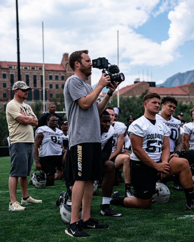 John Snelson gathers film following a Colorado fall camp practice back in August. 
