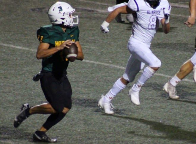 Horizon quarterback Skyler Partridge looks for a receiver during the Huskies' 24-15 home win over Sunrise Mountain.  He later had a 60-yard run to secure the victory.