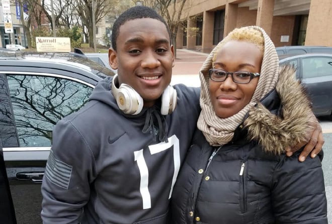 Flashback: An elated Bradshaw with his mother Kizzy after Army win over Navy last year