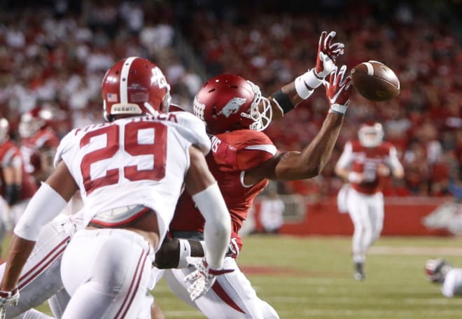 A pass deflects off of Arkansas wide receiver Jared Cornelius' hands with Alabama defensive back Minkah Fitzpatrick (29) in coverage during Alabama's 49-30 win over the Razorbacks in Fayetteville.