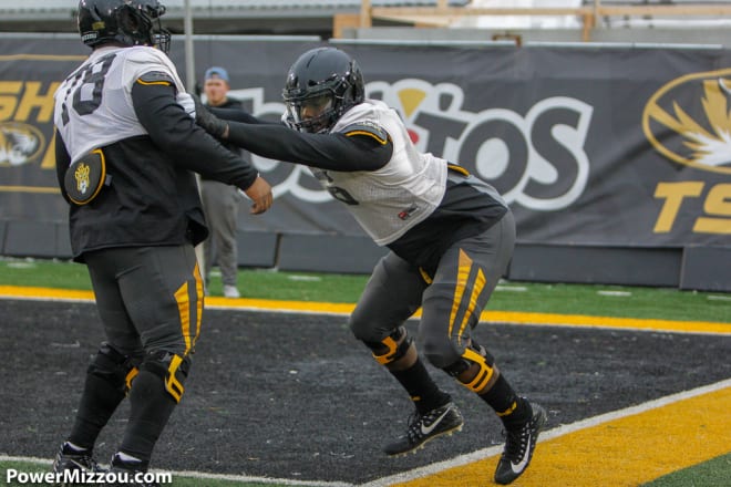 Sophomore defensive tackle Darius Robinson (right) has earned positive reviews during Missouri's fall camp.