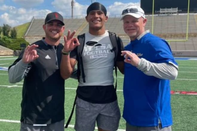 Devin Robinson with TU head coach Philip Montgomery and DC Luke Olson during a camp in June.