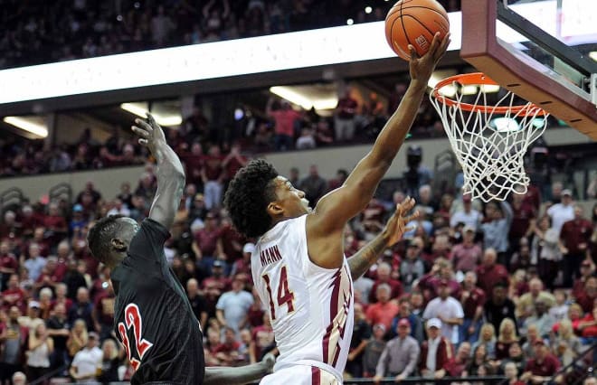 Terance Mann soars in for a basket Saturday against Louisville.