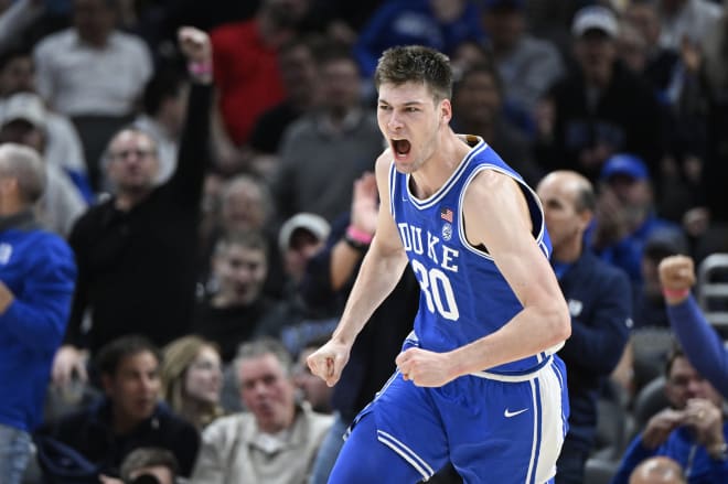 Duke freshman Kyle Filipowski reacts after scoring against Kansas during Tuesday night's Champions Classic. 