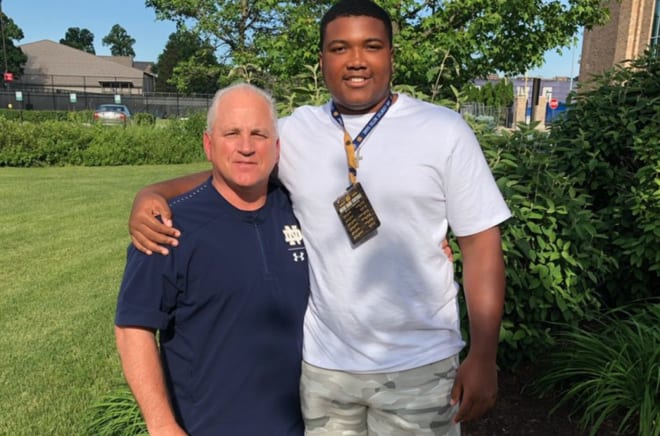 Blake Fisher with Notre Dame OL coach Jeff Quinn during a campus visit