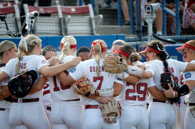 Alabama huddles before a softball game between Alabama and Stanford in the Women's College World Series at USA Softball Hall of Fame Stadium in in Oklahoma City, Friday, Photo | SARAH PHIPPS/THE OKLAHOMAN / USA TODAY NETWORK