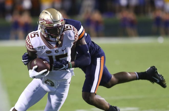 FSU receiver Tamorrion Terry fights for yardage Saturday at Virginia.