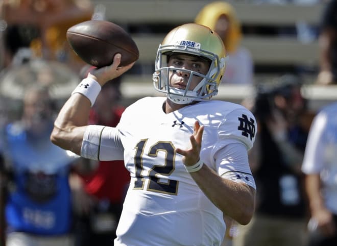 Notre Dame's Ian Book (12) looks to pass against Wake Forest in the first half of an NCAA college football game in Winston-Salem, N.C., Saturday, Sept. 22, 2018. (AP Photo/Chuck Burton)