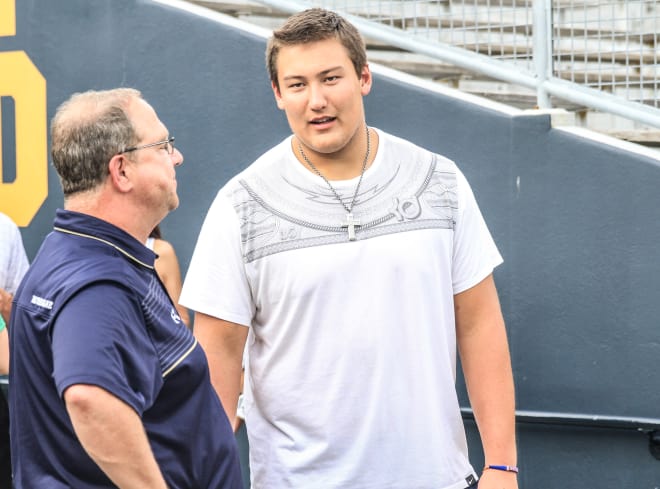 Five-star Graham (Wash.) Kapowsin offensive tackle Foster Sarell with offensive line coach Harry Hiestand at Irish Invasion.