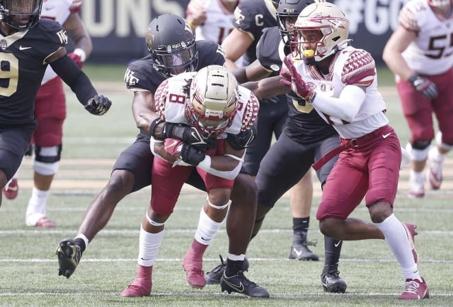 FSU running back Treshaun Ward fights for yards Saturday at Wake Forest.