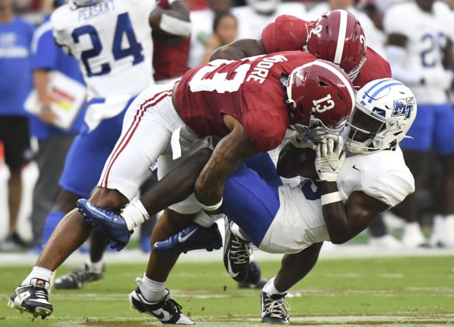 Alabama Crimson Tide defensive back Malachi Moore (13) and defensive back Caleb Downs (2) combine to tackle Middle Tennessee Blue Raiders wide receiver Elijah Metcalf (9) during the first half at Bryant-Denny Stadium. Photo | Gary Cosby Jr.-USA TODAY Sports