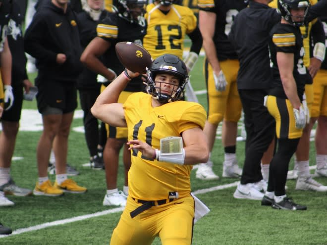 Marco Lainez slings a pass in Iowa's open spring practice. 