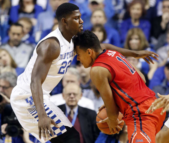 Ole Miss forward Sebastian Saiz is stopped by Kentucky's Alex Poythress in the Rebels' 83-61 loss at Rupp Arena Saturday night. It was the Southeastern Conference opener for both teams.